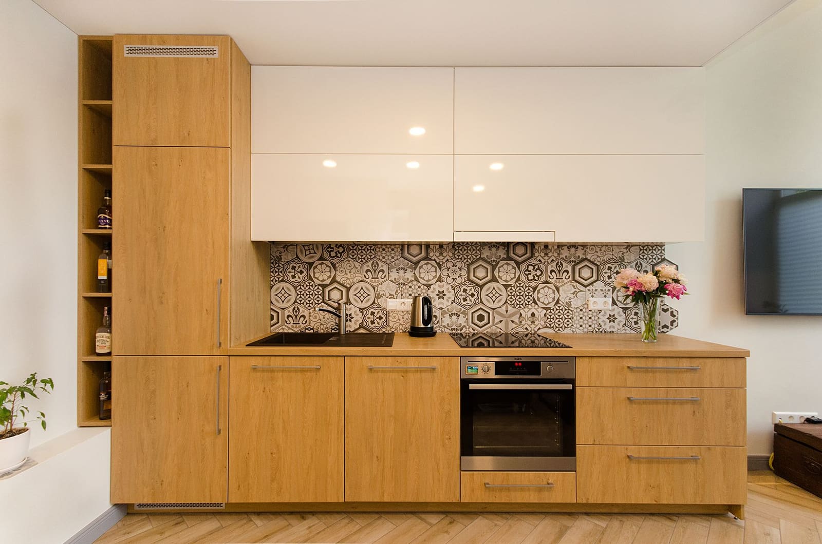 Wooden modular kitchen with a tiled backsplash