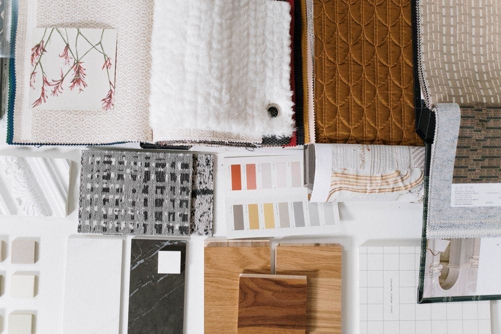 Fabric and finish swatches laid out for material selection